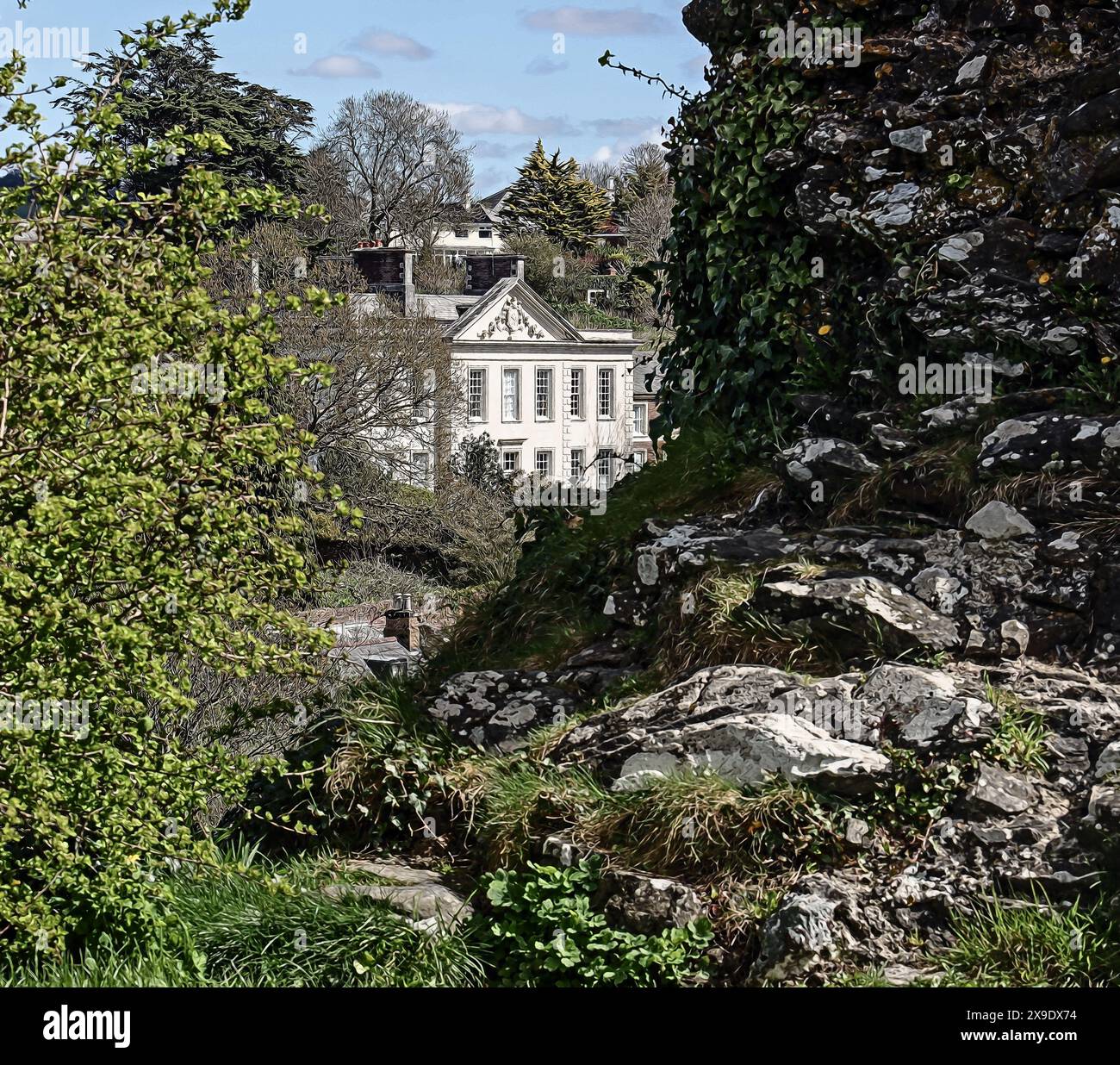 Photo illustration Plympton House seen framed by ruins of Plympton Castle in Pympton St Maurice, Plymouth, Devon Stock Photo