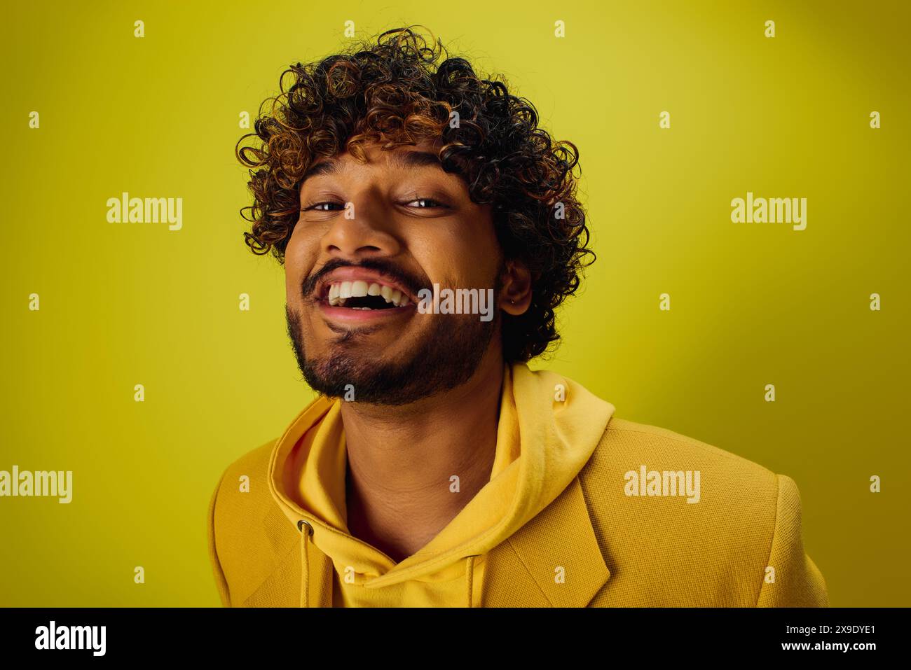 Happy curly haired indian man hi-res stock photography and images - Alamy