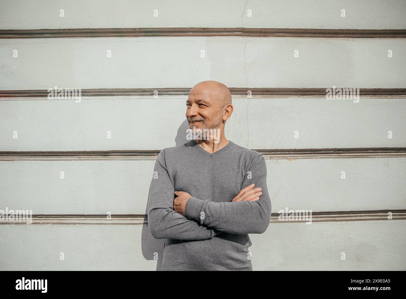 Mature male man standing wall hi-res stock photography and images - Alamy