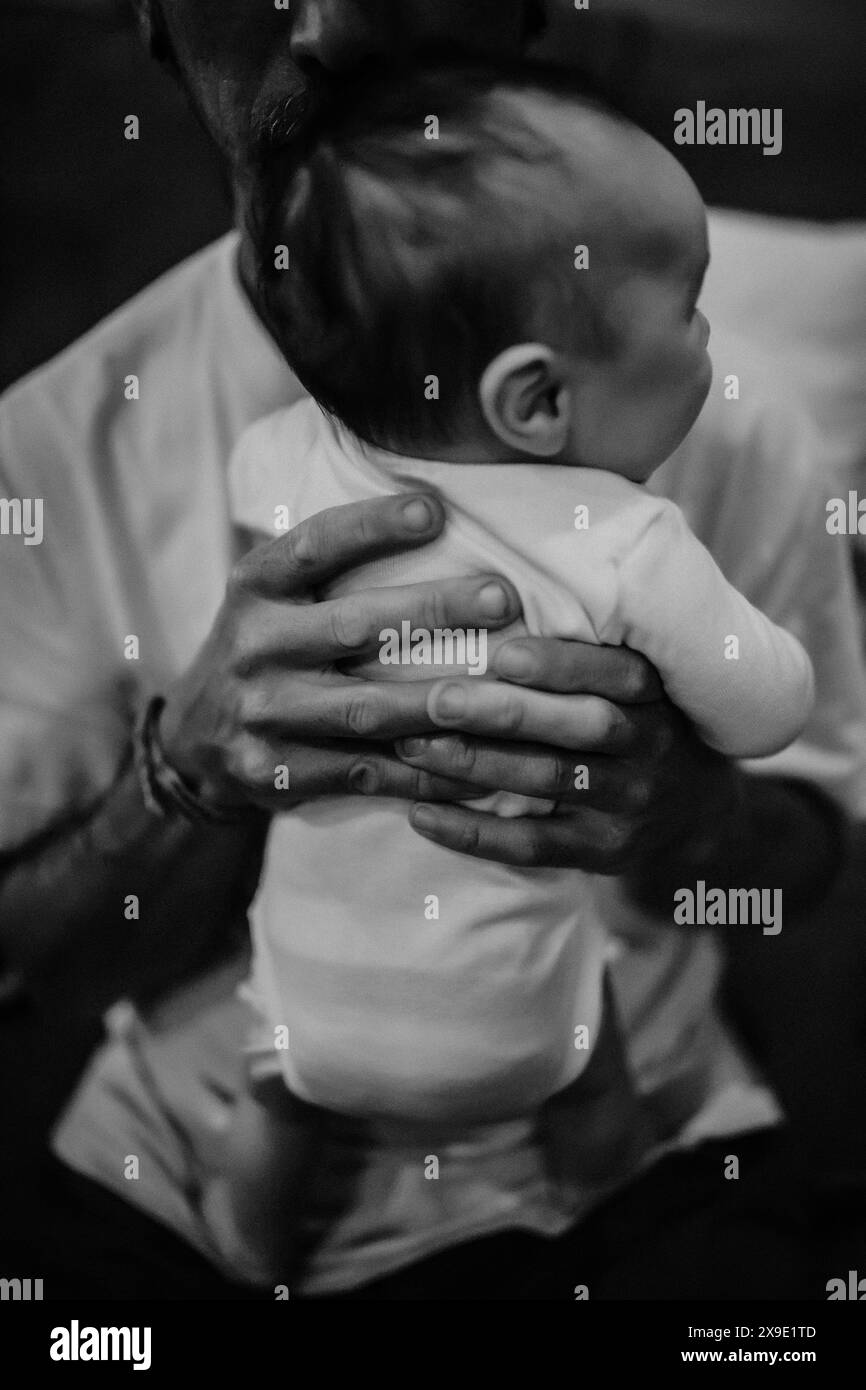 Father holding infant son black and white Stock Photo - Alamy