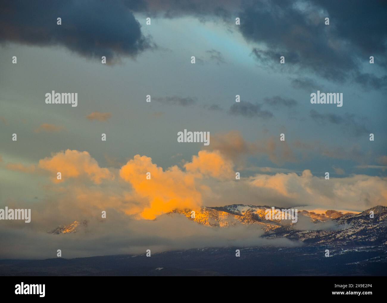 Mountain Top Covered in Clouds Stock Photo - Alamy