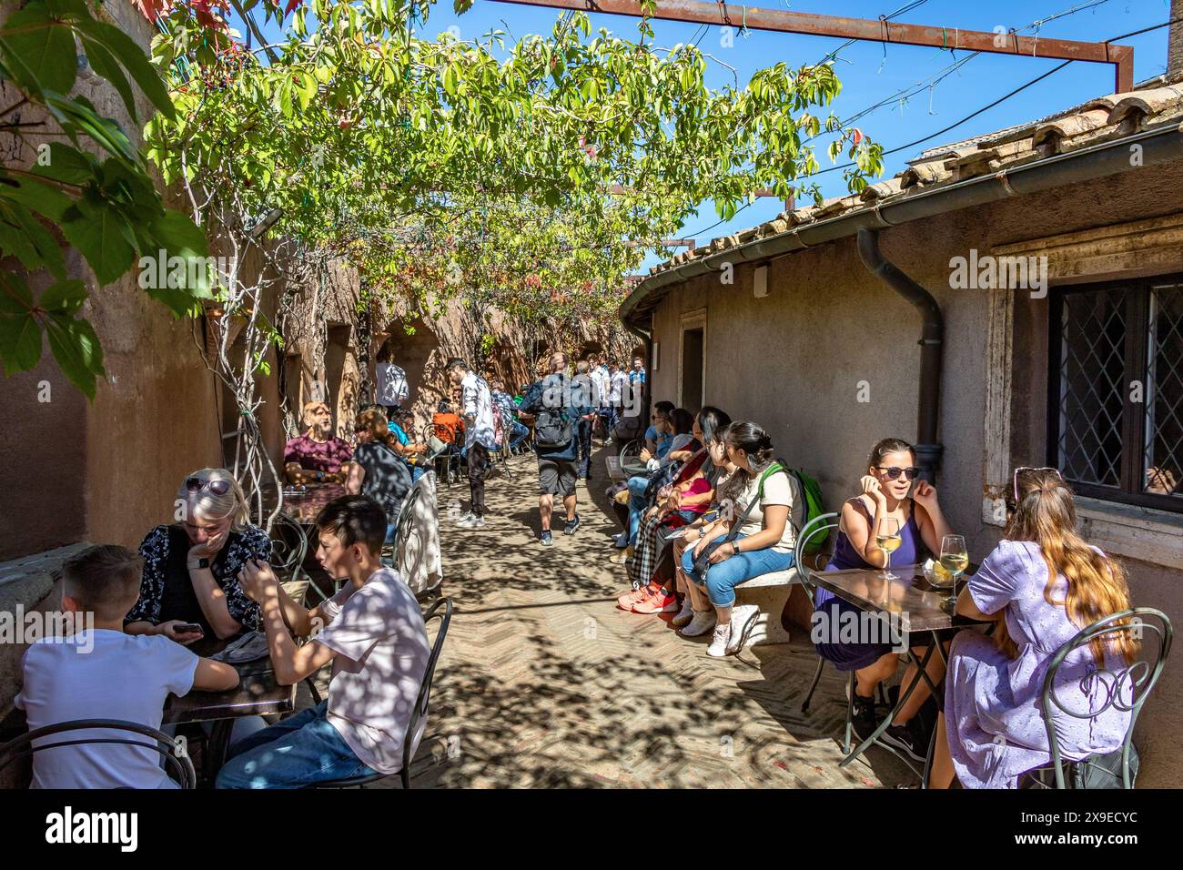 People sitting down enjoying food and drinks at The Cafe inside Castel Sant'Angelo an historic fortress in Rome ,Italy Stock Photo