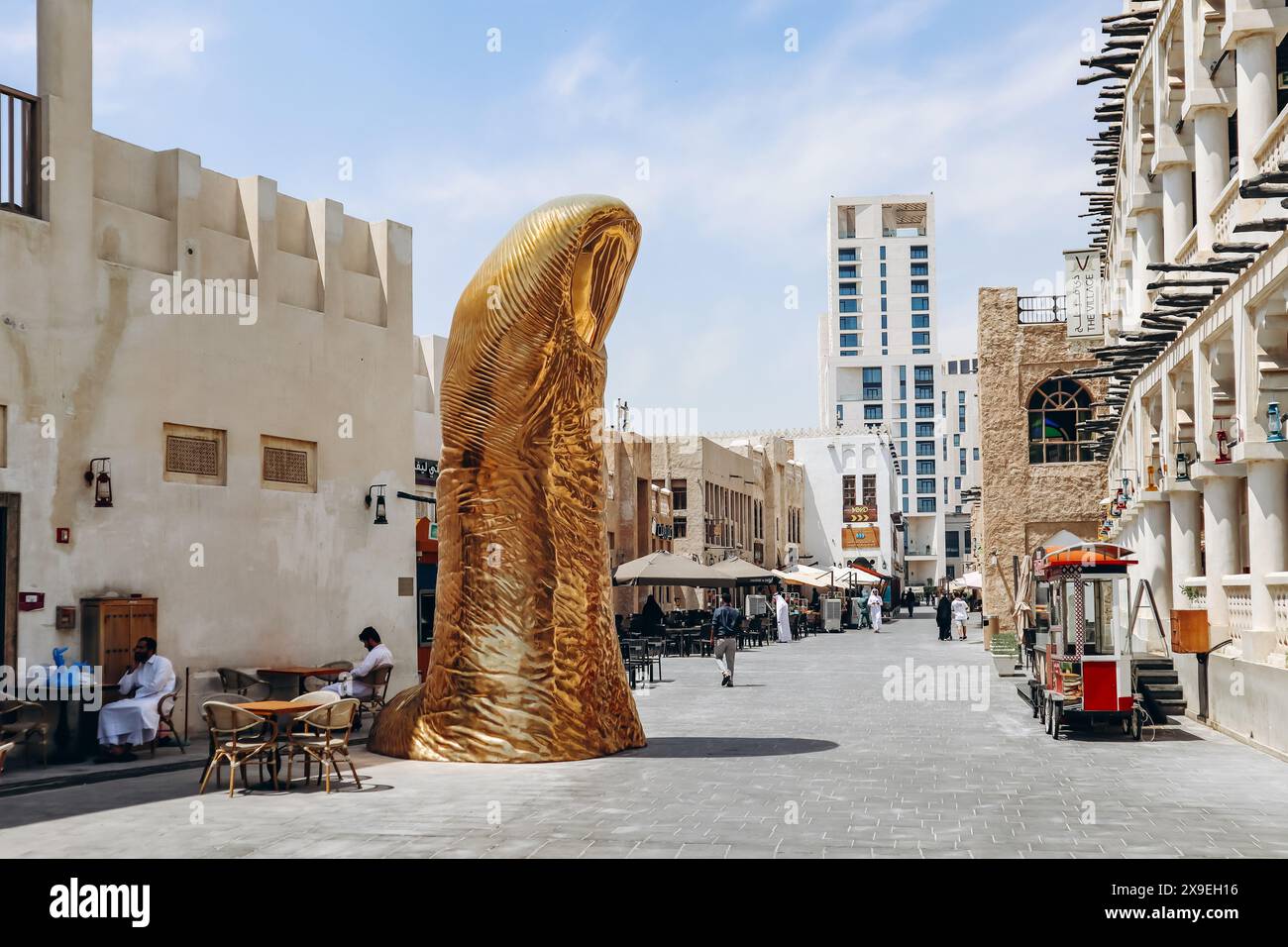 Doha, Qatar 1 May 2024 The Golden Thumb Statue, an art piece by