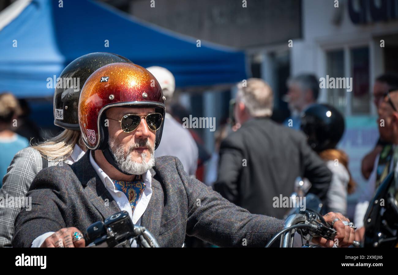 Classic and vintage style motorcycles, dressing dapper and riding to raise funds and awareness for men’s mental health and prostate cancer research. Stock Photo