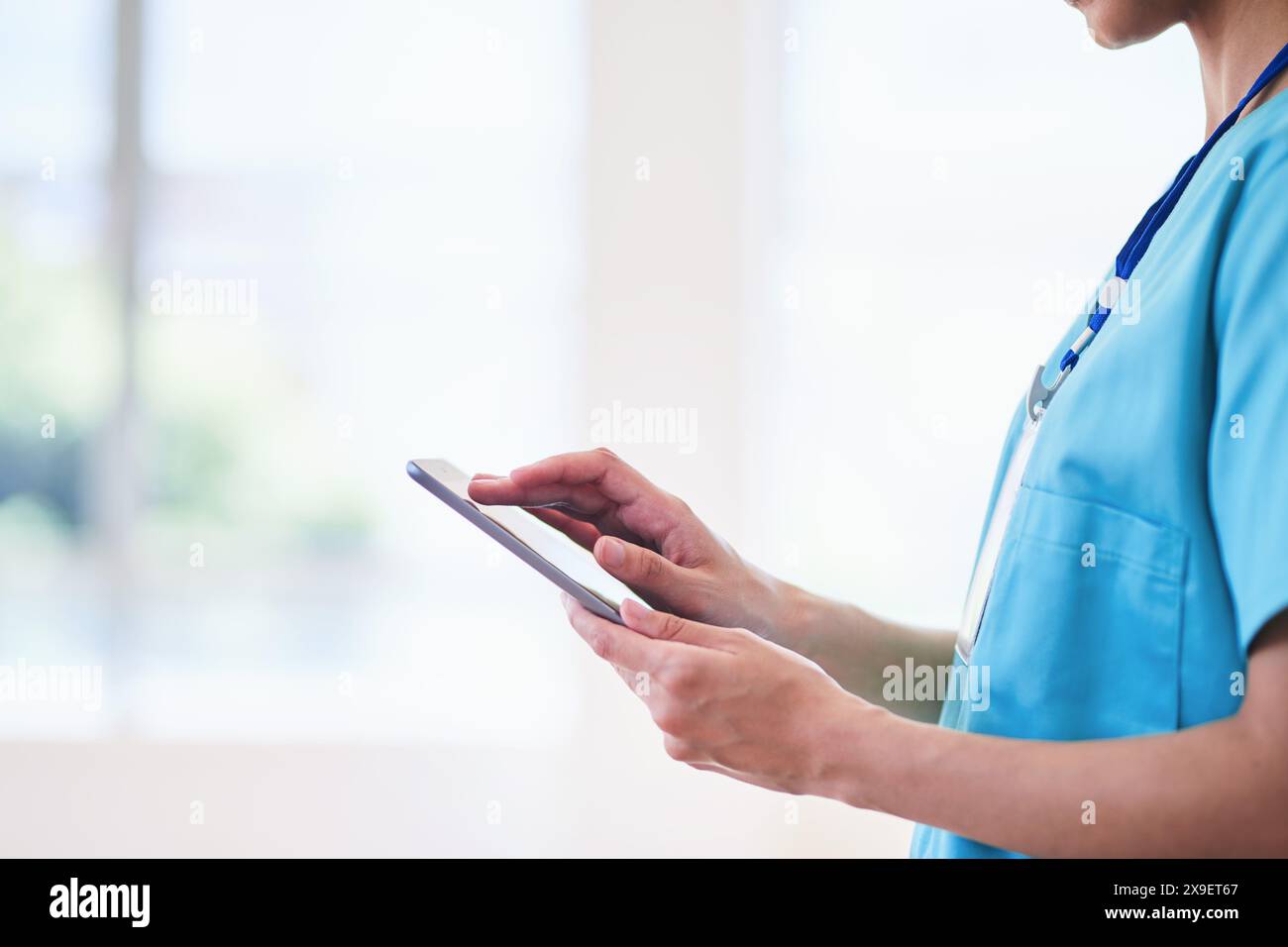 Healthcare Professional Using Digital Tablet in Hospital Setting Stock Photo