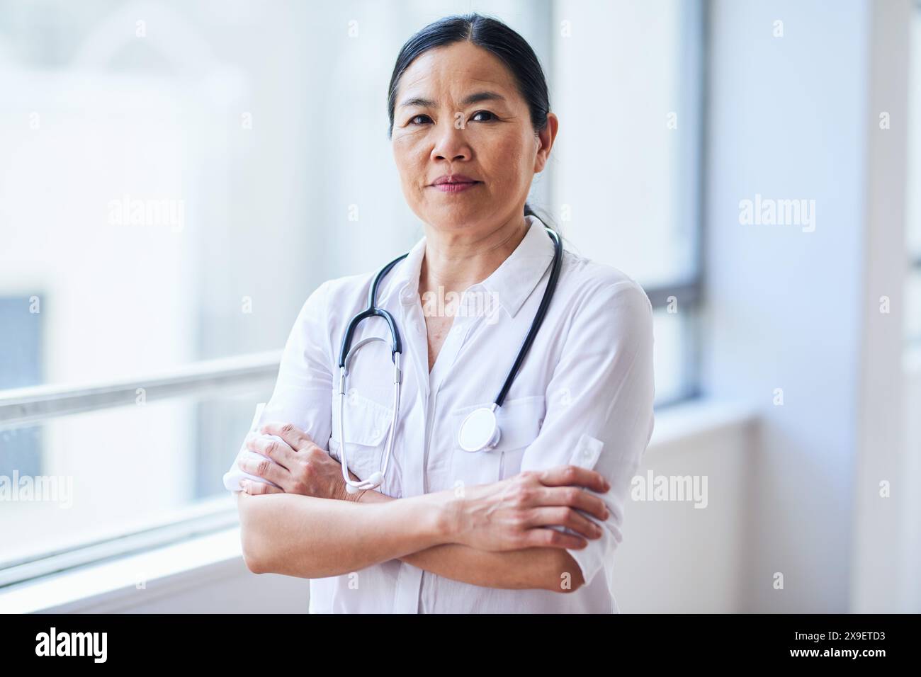 Female professional standing arms hi-res stock photography and images ...