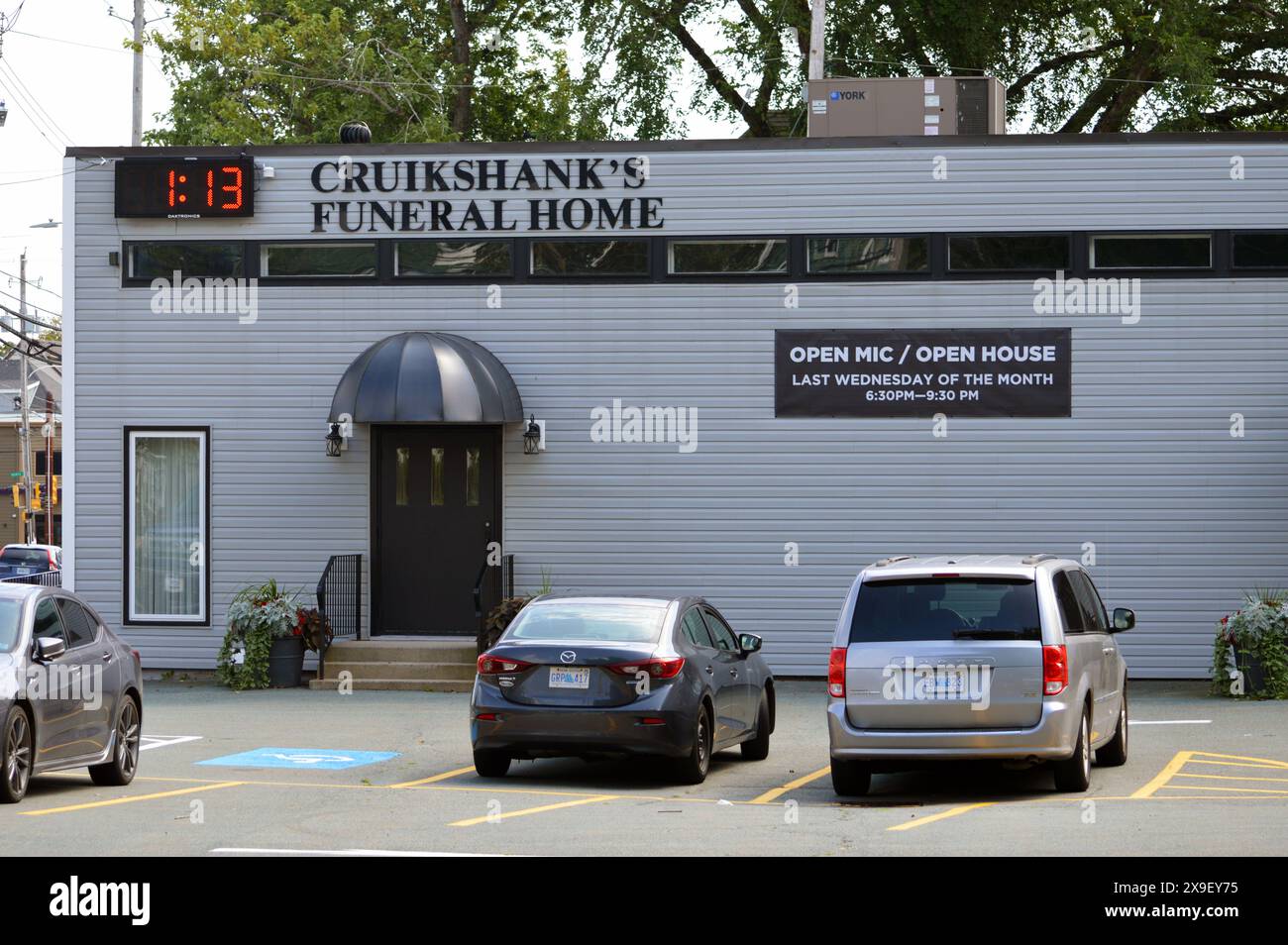 Open mic / open house advertisement posted on the exterior of