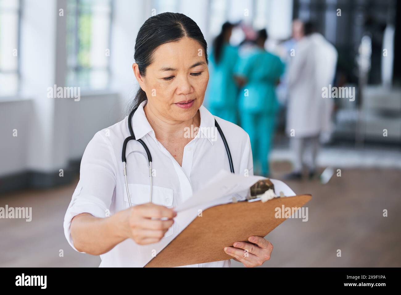 Asian female doctor reviewing hi-res stock photography and images - Alamy