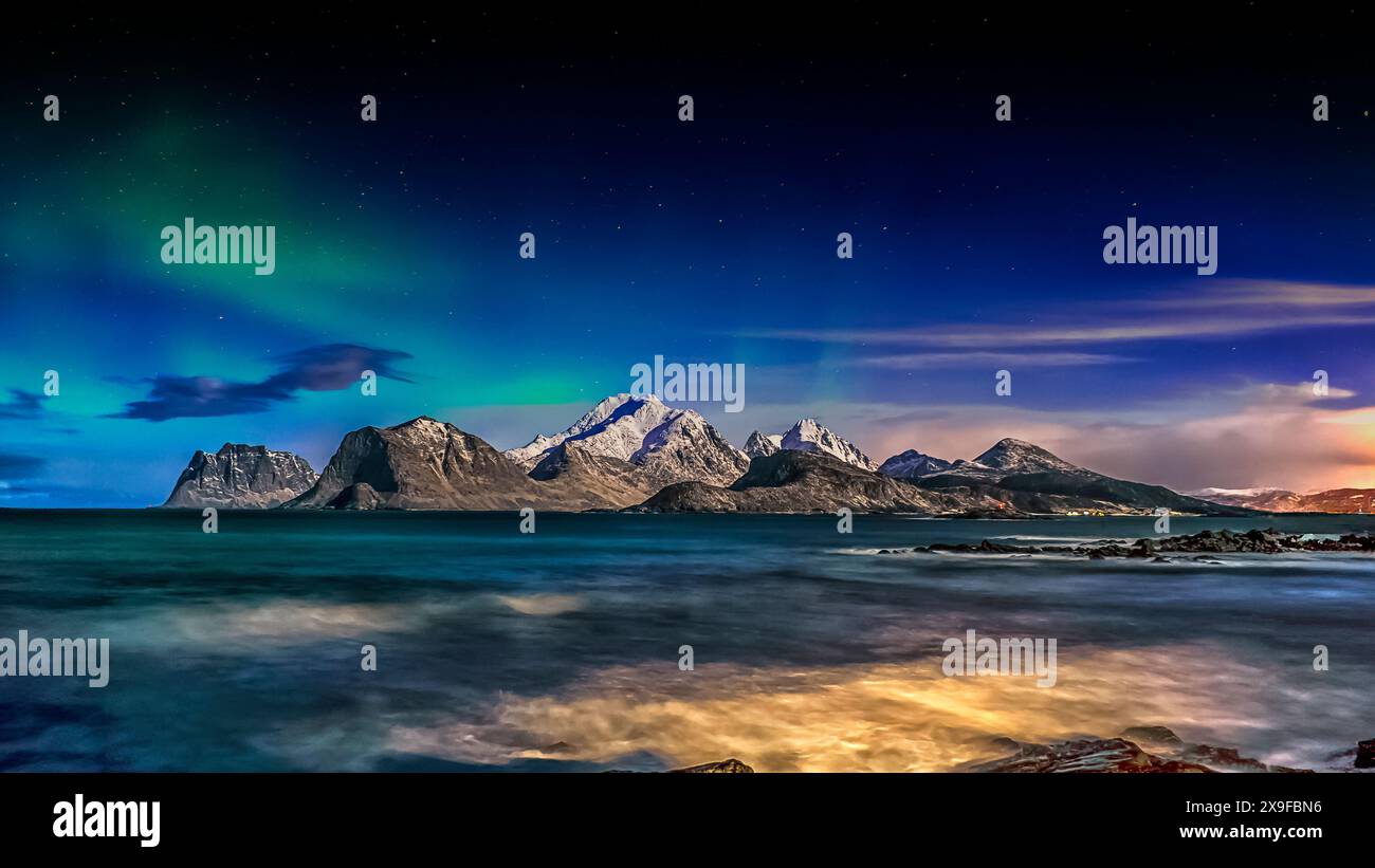 Northern lights over coastal landscape and Mt Himmeltinden, Lofoten, Lofoten and Vesteral Islands, Nordland, Norway Stock Photo