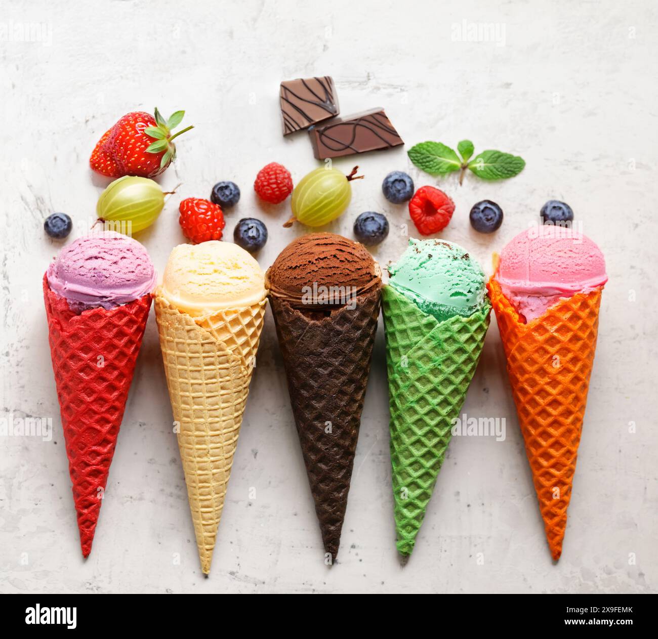 assorted ice cream of different flavors in waffle cones Stock Photo - Alamy