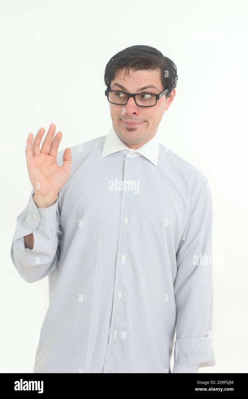 shy and insecure male nerd wearing glasses on white background Stock Photo