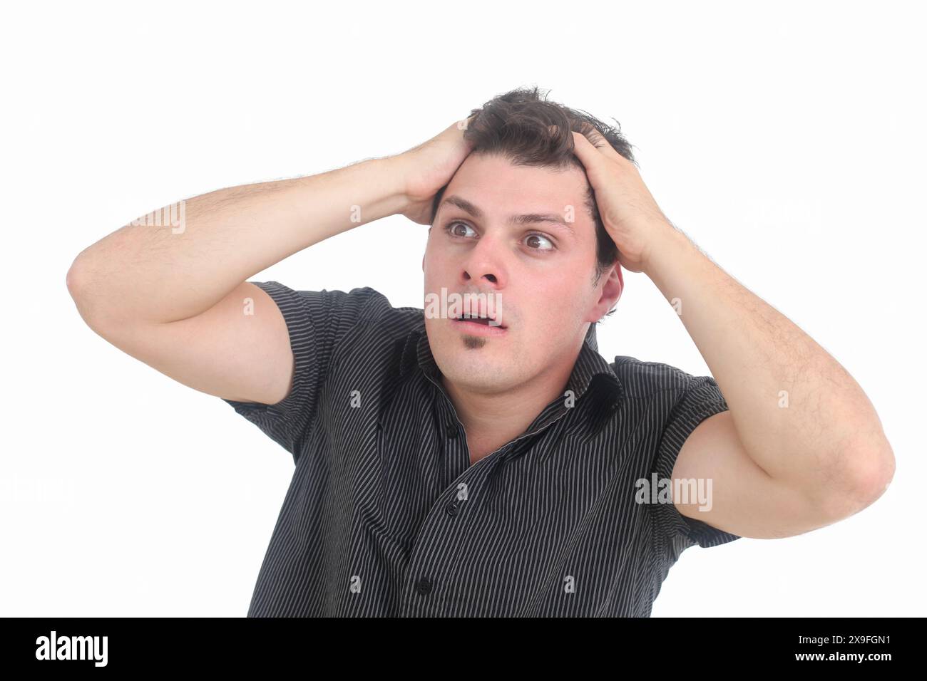 frustrated young man on white background Stock Photo