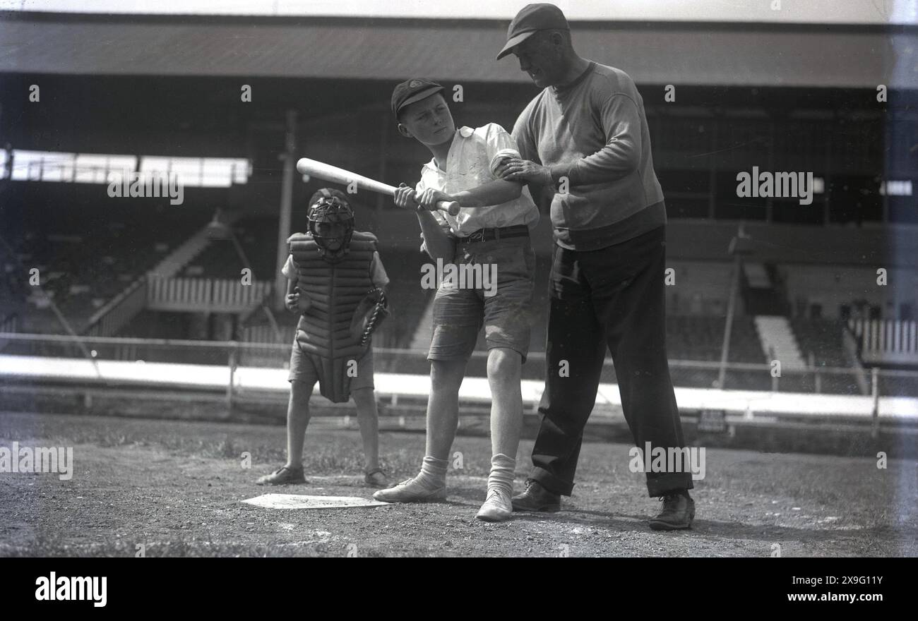 1940s, historical, baseball, a boy batter wearing cap, shorts and ...