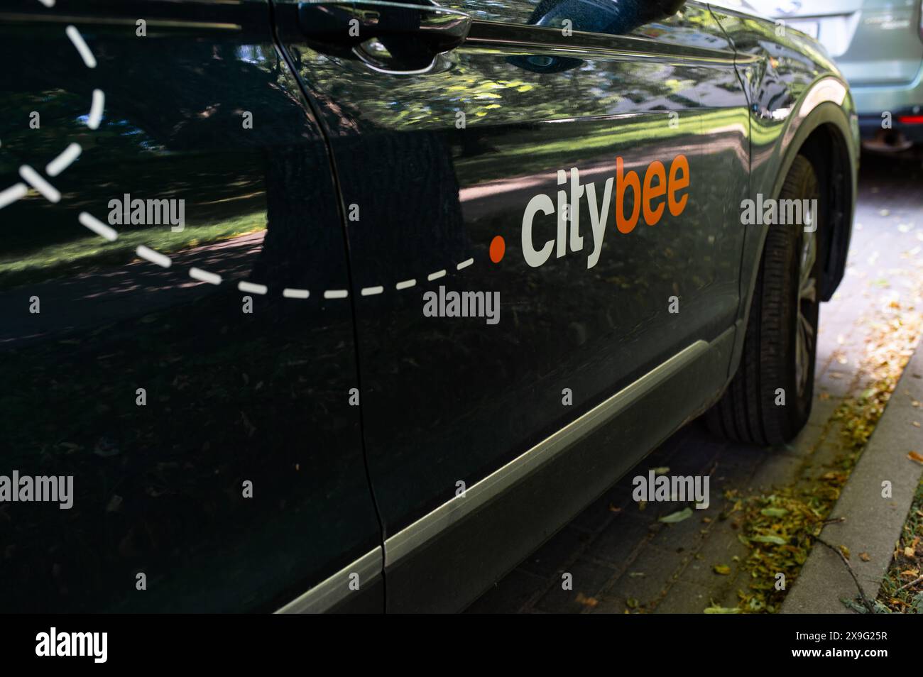 City bee car sharing, short term rental car side view. Lithuania/Vilnius Stock Photo