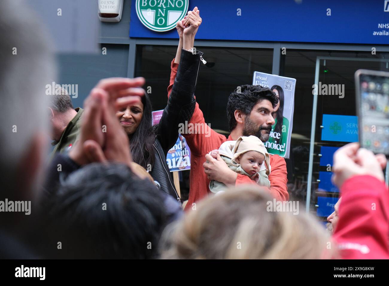 Former Labour candidate for Chingford and Woodford Green Faiza Shaheen and her husband at a rally after she was deselected by the Labour party Stock Photo