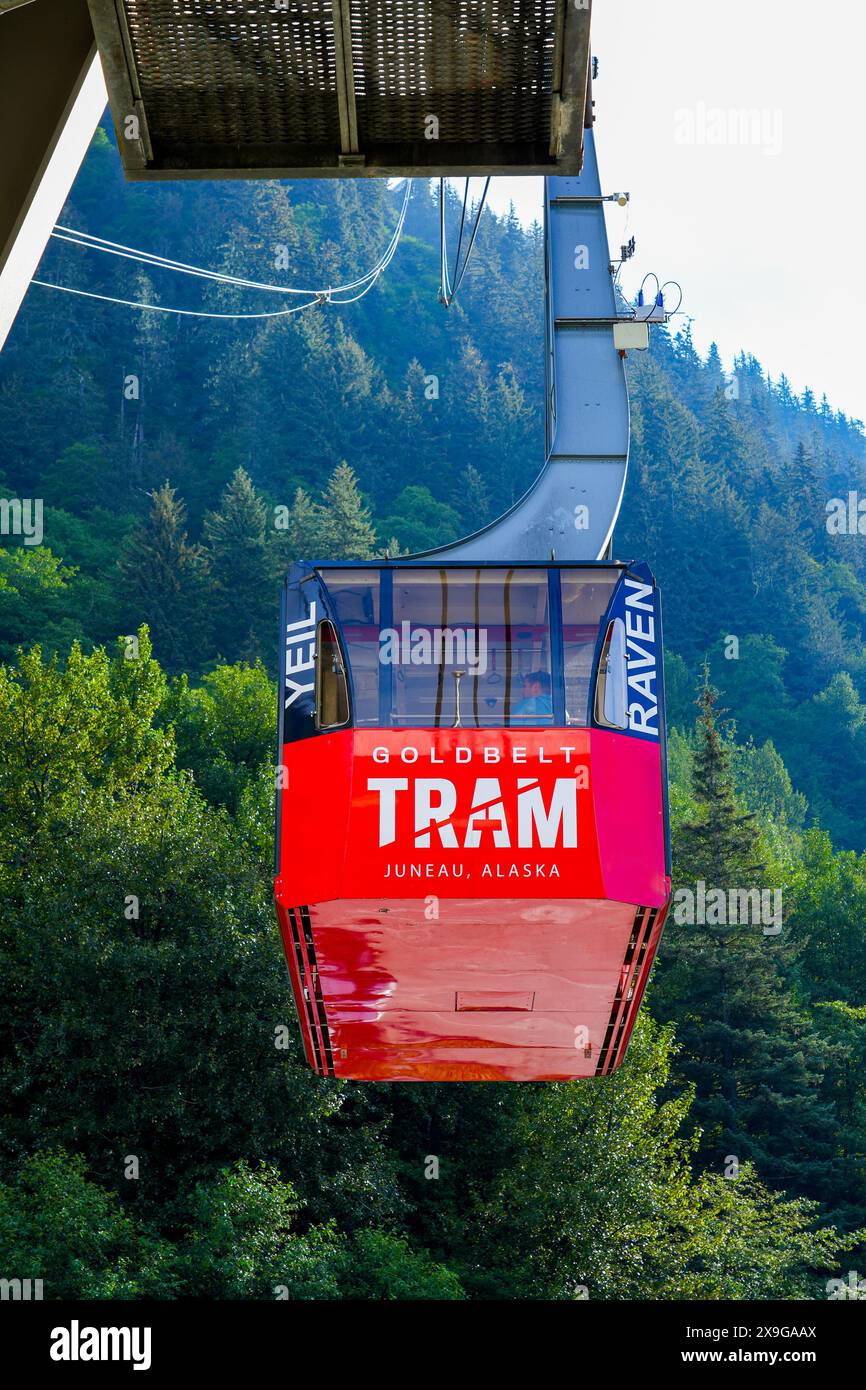Red gondola of the Goldbelt Tram cablecar ascending Mount Roberts