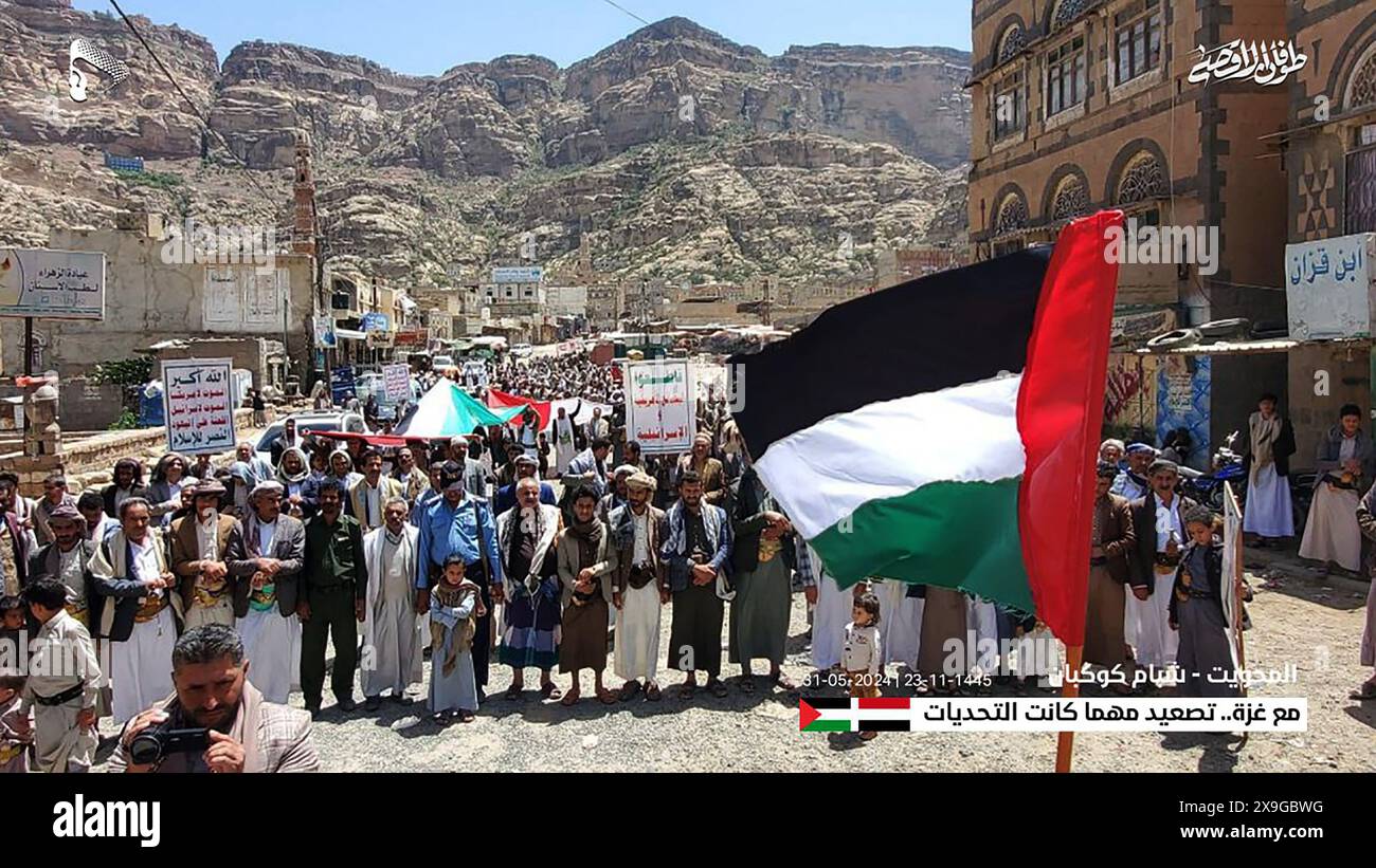 Sanaa, Yemen. 31st May, 2024. A person holds Palestinian flag, as protesters, largely Houthi supporters, rally to show solidarity with Palestinians in Gaza, amid the ongoing conflict between Israel and the Palestinian, in Sanaa, Yemen, on Friday on May 31, 2024. Photo by Houthi Group press Service/ Credit: UPI/Alamy Live News Stock Photo