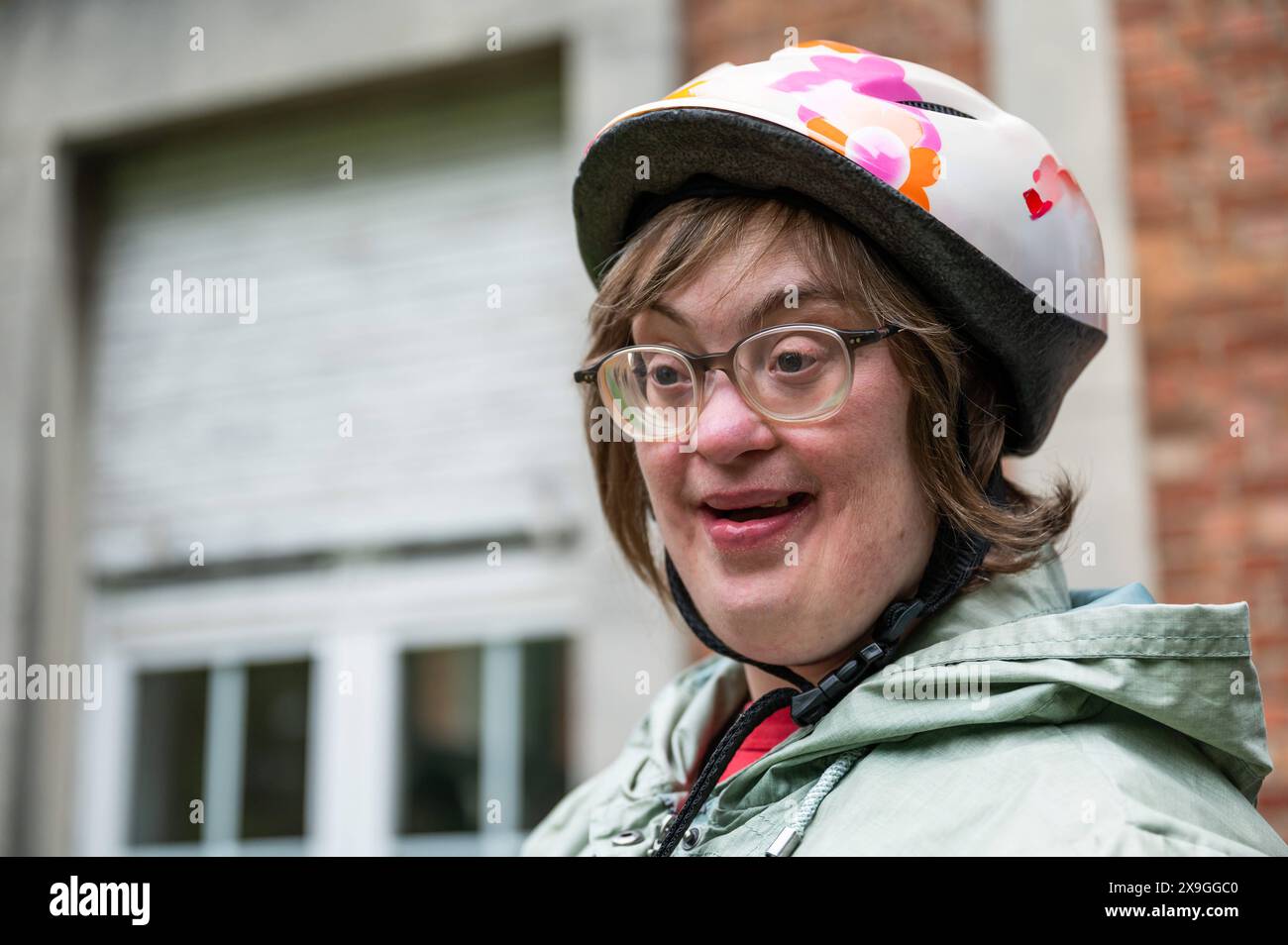 Outdoor portrait of a 41 yo woman with the Down Syndrome wearing a