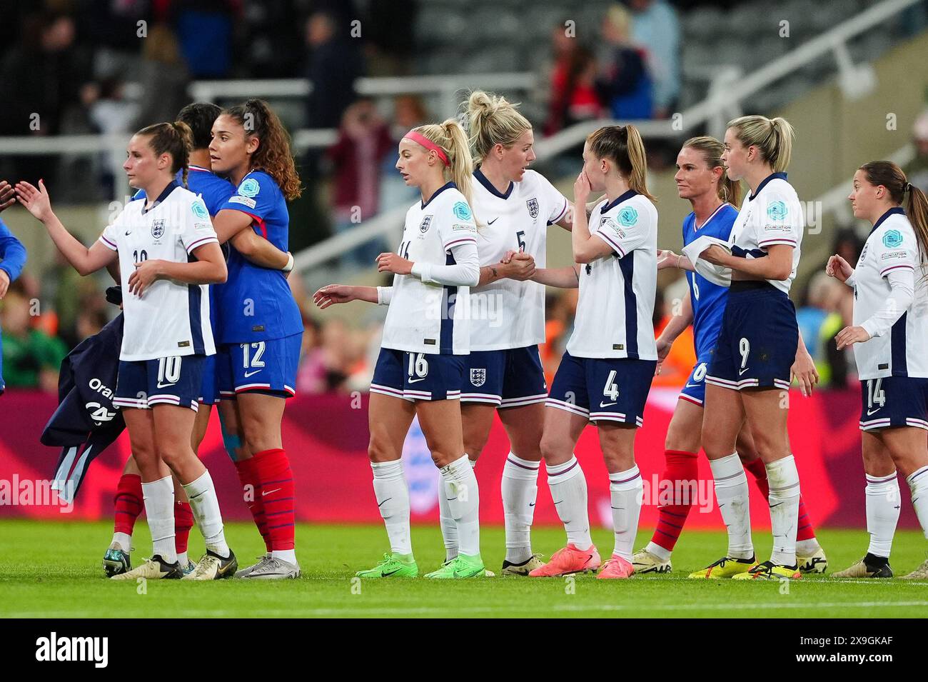 Players from both teams embrace following the UEFA Women's Euro 2025