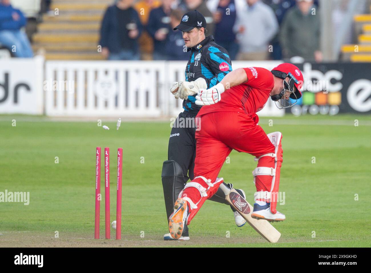 Gareth Roderick kicks the ball against the stumps but Steven Croft is
