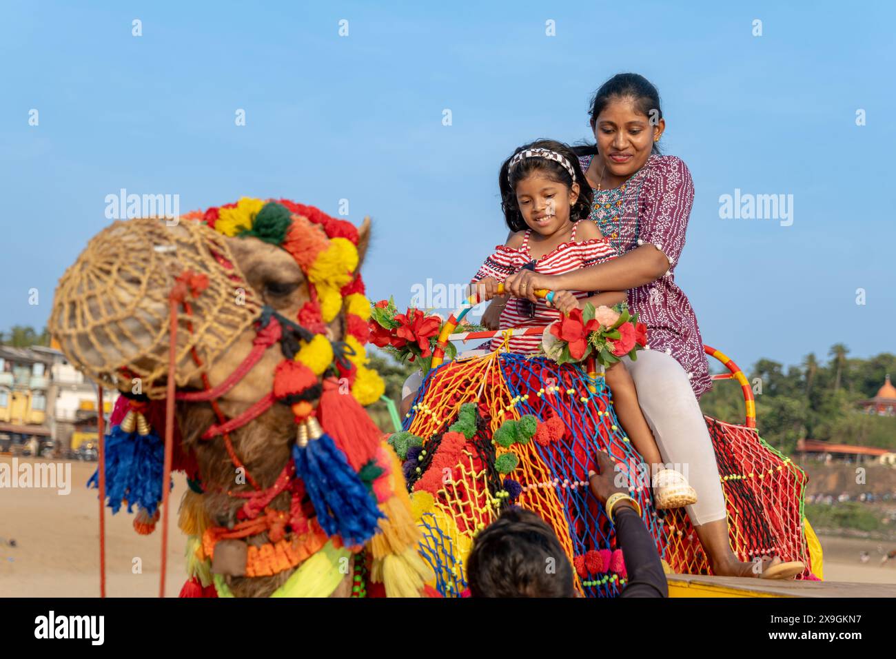 A colorful camel ride by the beach brings mother and daughter closer ...
