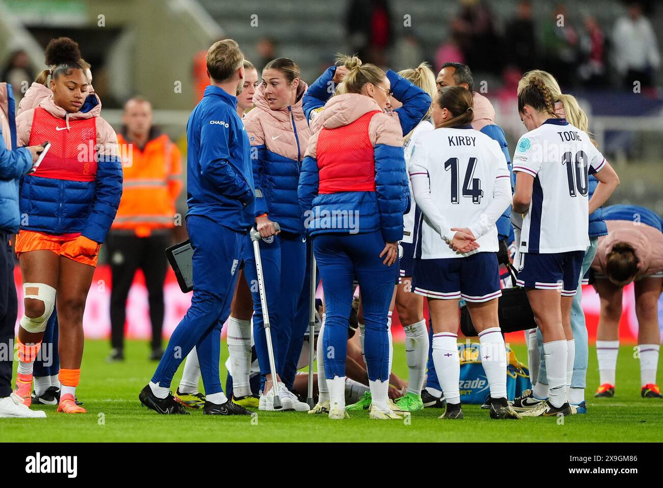 England goalkeeper Mary Earps on crutches with teammates following the