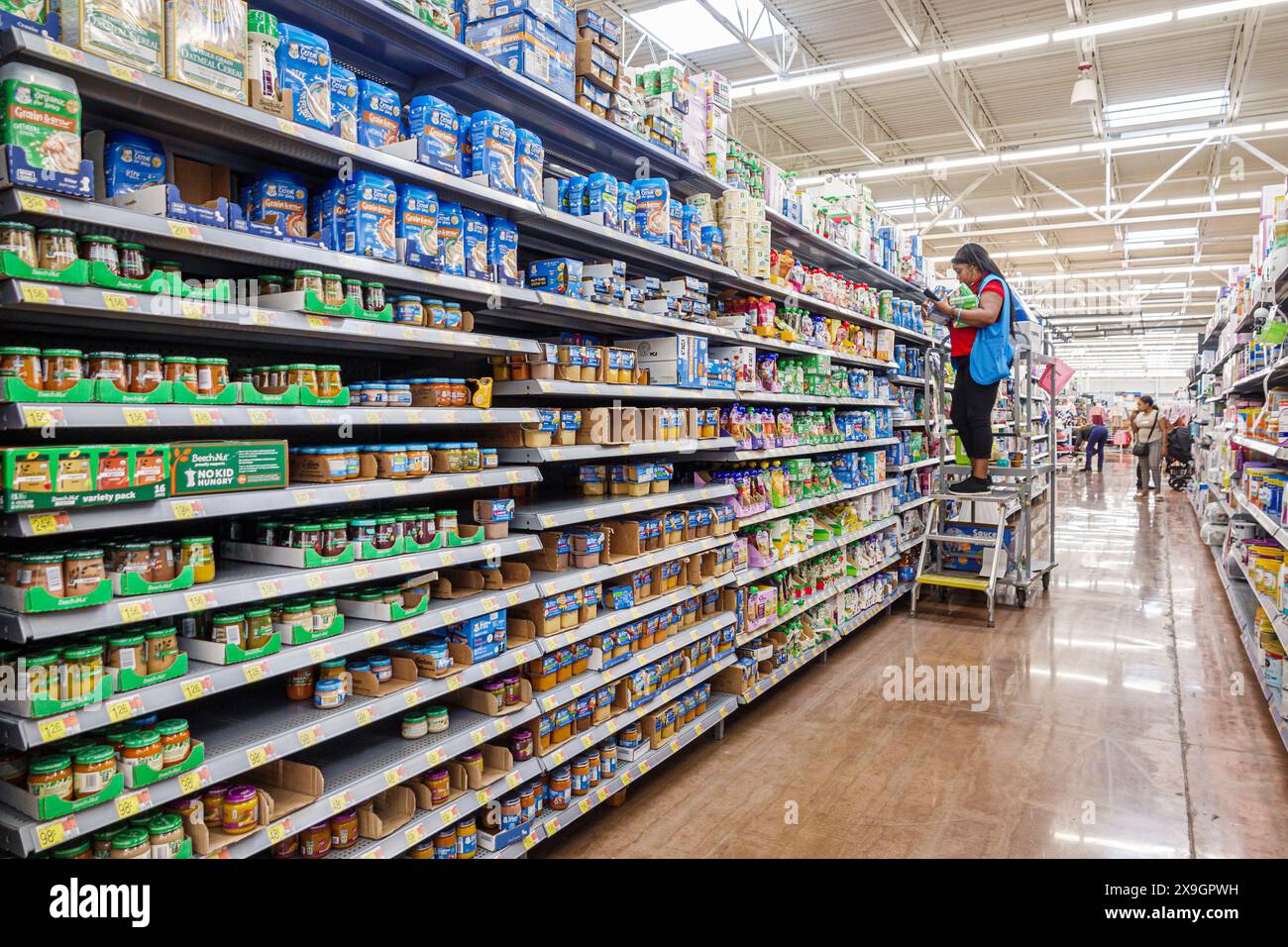 North Miami Beach Florida,Walmart discount department grocery store,inside interior,shelves display sale,baby food bottles Beech Nut,Black Blacks Afri Stock Photo
