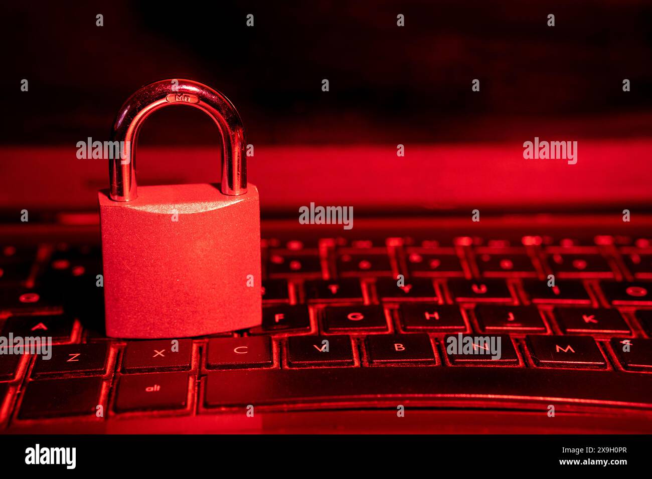 Cybersecurity concept, padlock on laptop computer keyboard Stock Photo