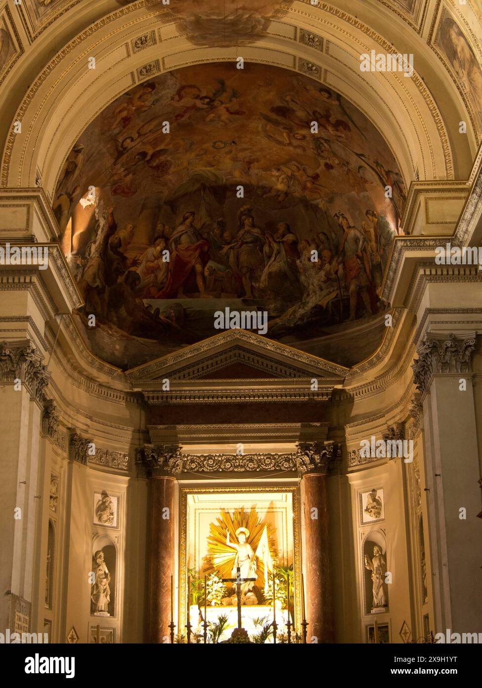 Interior of a church with an ornate altarpiece and sacred architecture, softly lit, palermo in sicily with an impressive cathedral, monuments and old Stock Photo