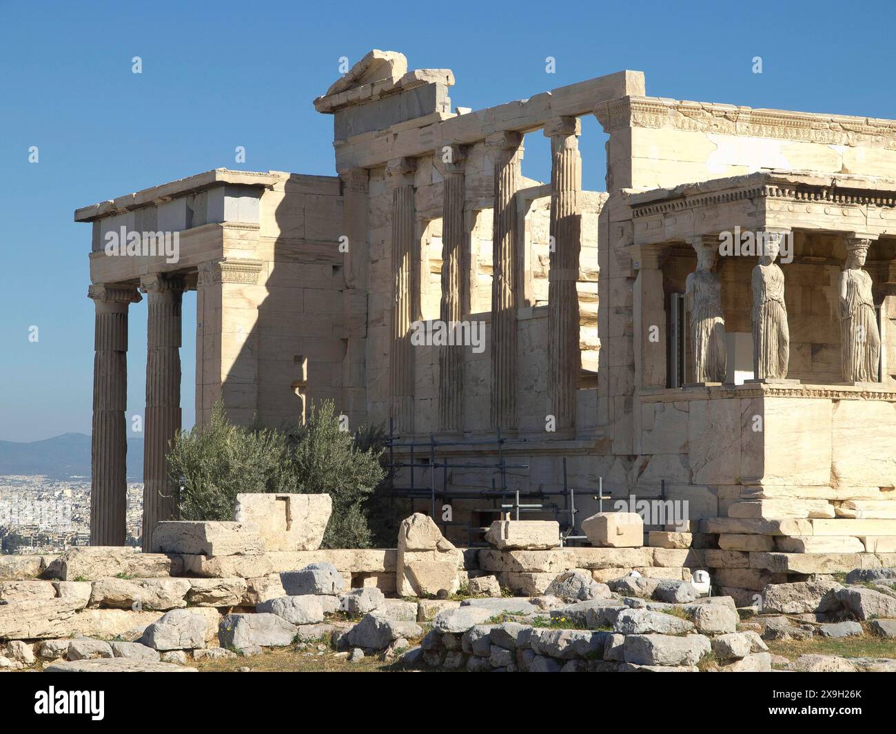 Ancient temple with columns and ruins surrounded by stones under a ...