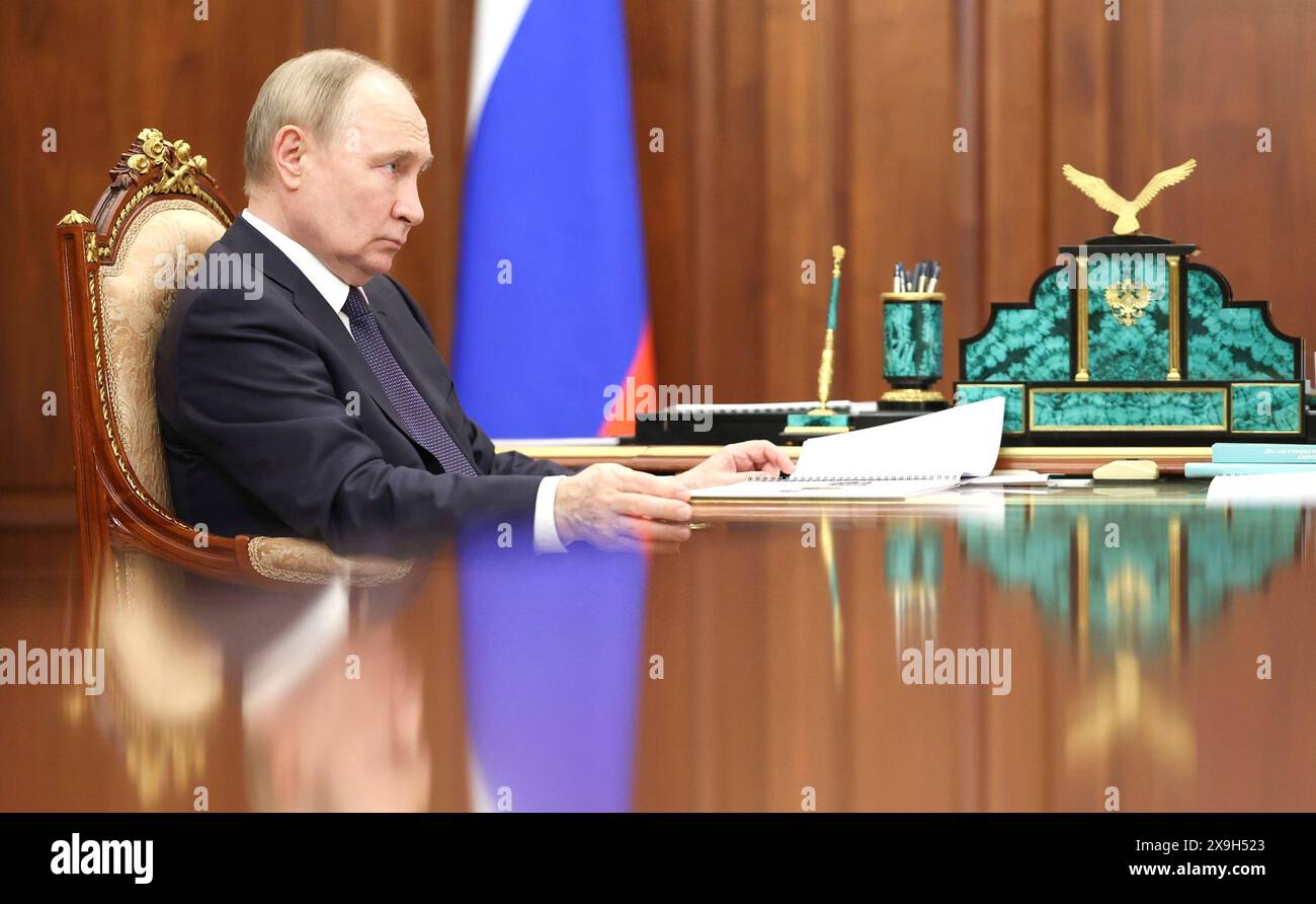 Moscow, Russia. 31st May, 2024. Russian President Vladimir Putin listens to Children's Rights Commissioner Maria Lvova-Belova during a face-to-face meeting at the Kremlin, May 31, 2024, in Moscow, Russia. Credit: Alexander Kazakov/Kremlin Pool/Alamy Live News Stock Photo