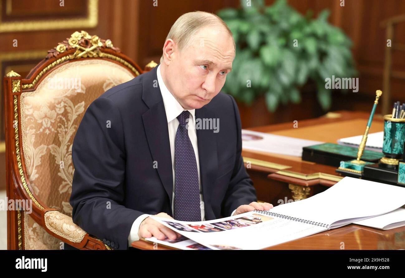 Moscow, Russia. 31st May, 2024. Russian President Vladimir Putin listens to Children's Rights Commissioner Maria Lvova-Belova during a face-to-face meeting at the Kremlin, May 31, 2024, in Moscow, Russia. Credit: Alexander Kazakov/Kremlin Pool/Alamy Live News Stock Photo