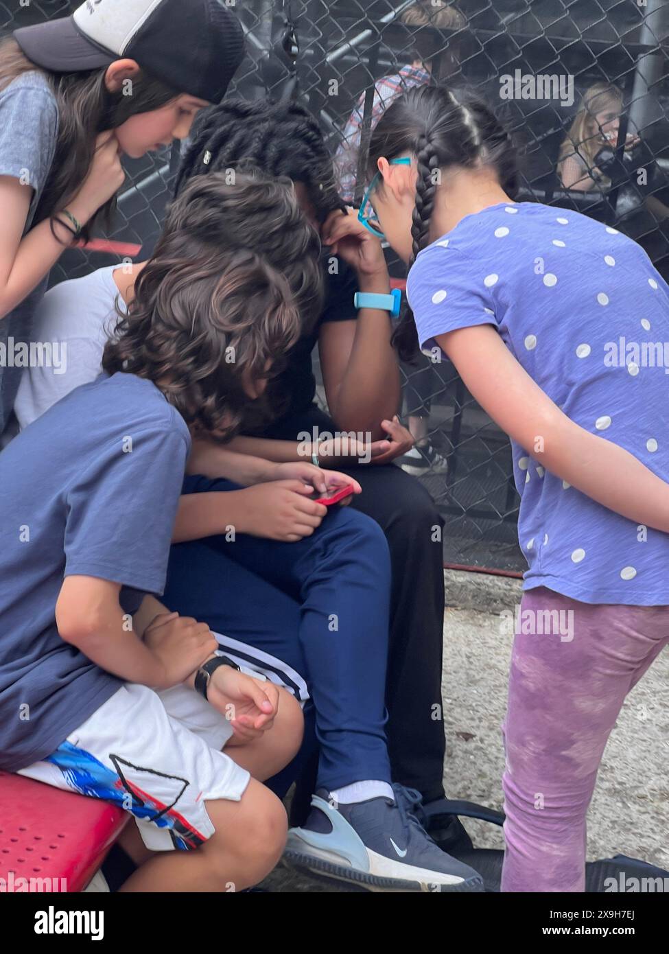 School kids gathered around hi-res stock photography and images - Alamy