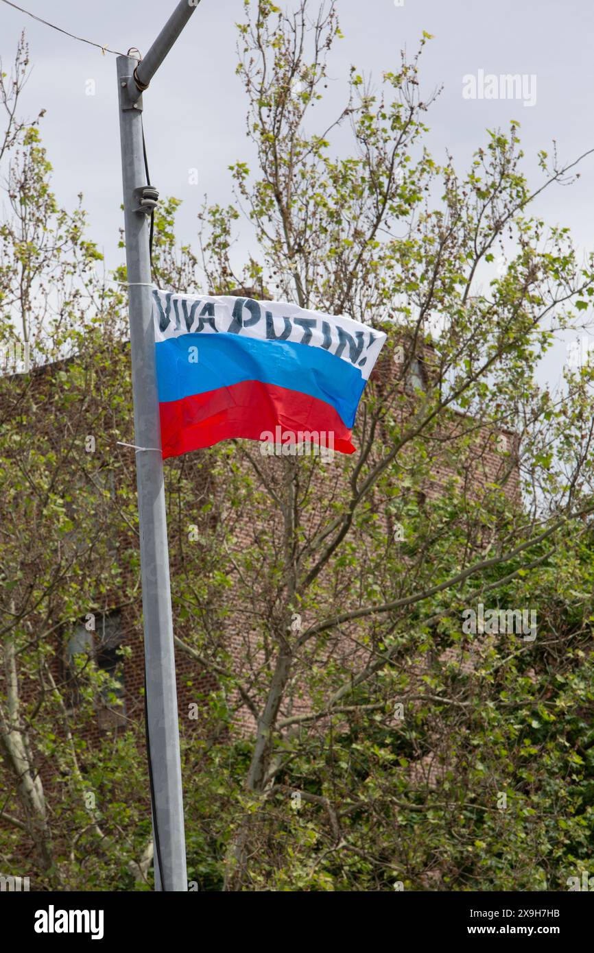 A Russian flag saying Viva Putin hoisted on a lamp post in Brooklyn, New York. It was pulled down in less than a day. Stock Photo
