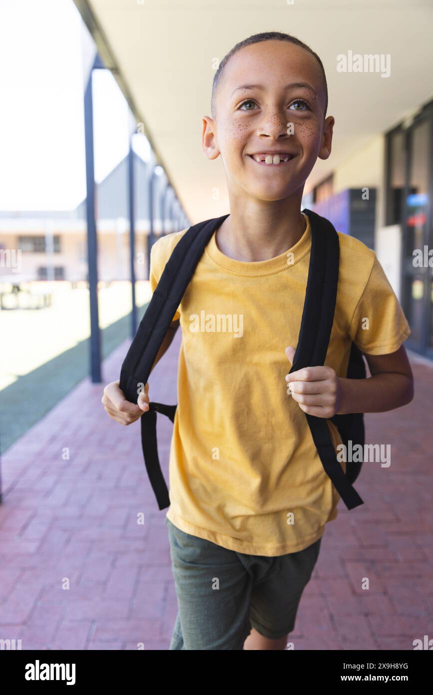 Biracial boy smiles at school Stock Photo - Alamy
