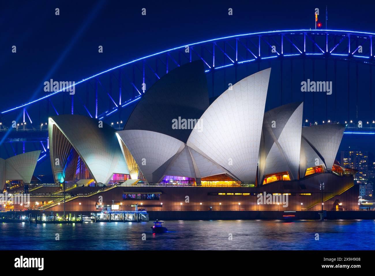 A night view of Sydney Opera House and Sydney Harbour Bridge in Sydney, New South Wales, Australia. Stock Photo