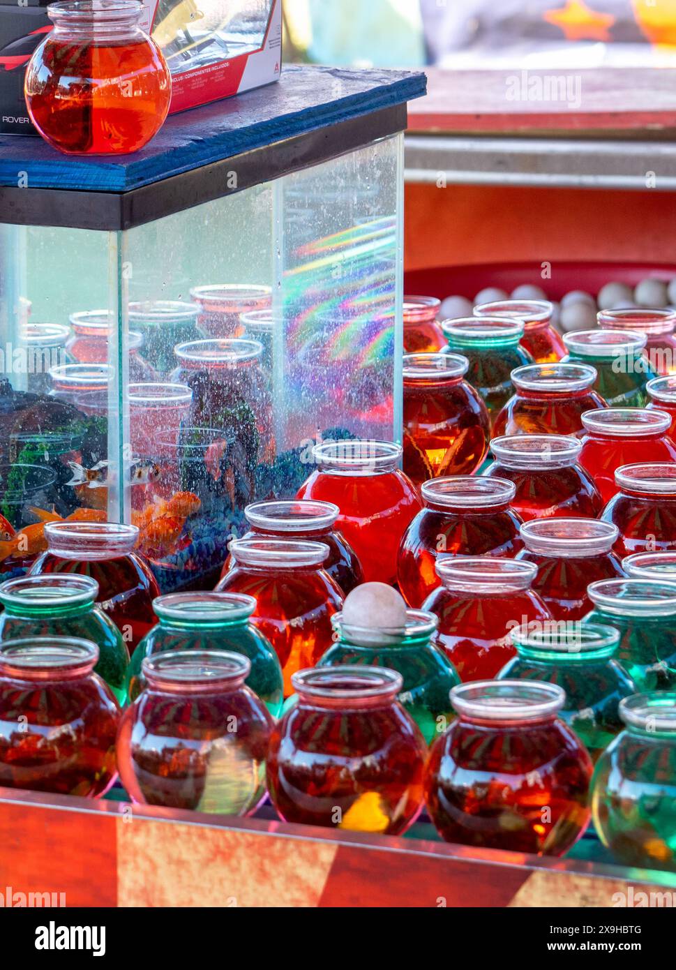 carnival ball toss game, throw a ping pong ball in the fish bowl and