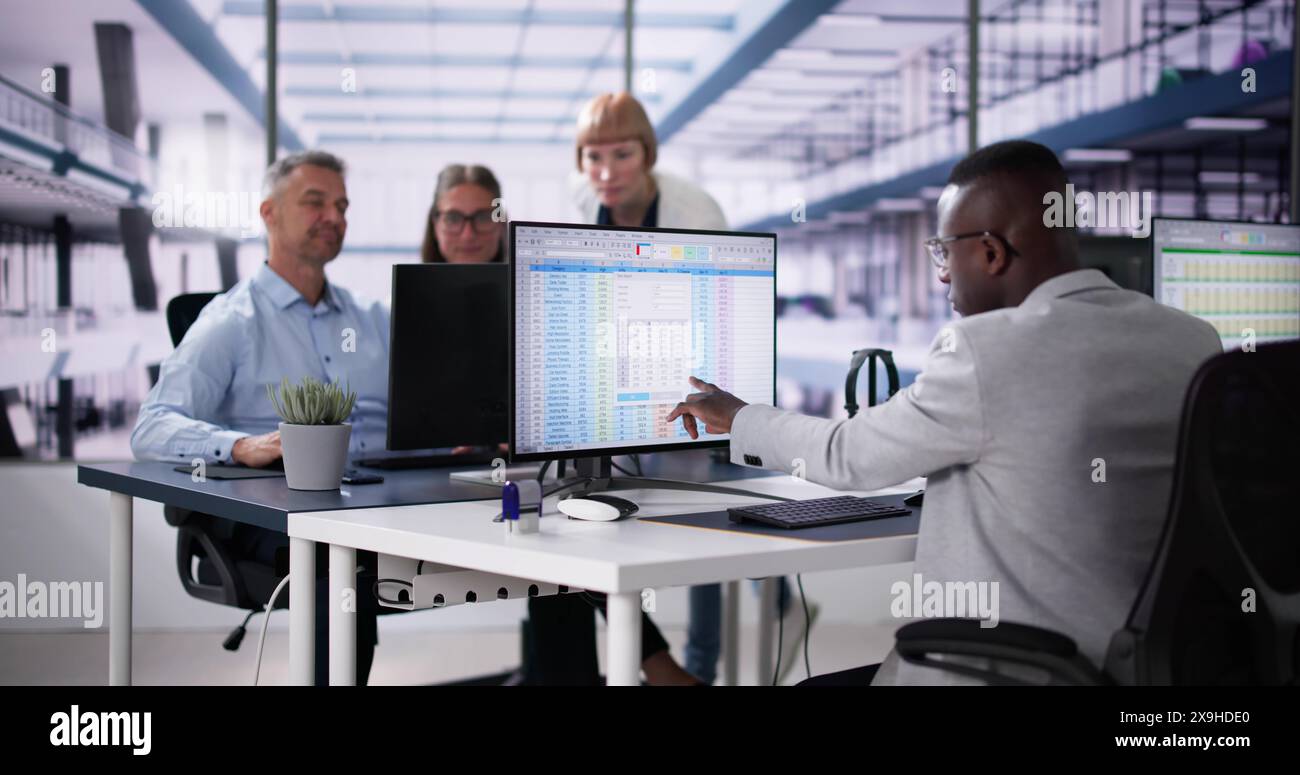 Data Analyst African Woman Using Spreadsheet On Computer Stock Photo