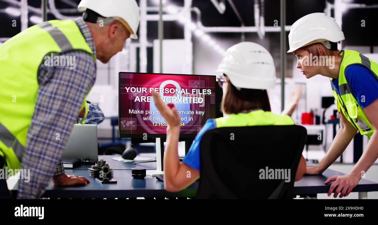 Shocked Engineer In Automated Semiconductor Factory During Ransomware Attack Stock Photo