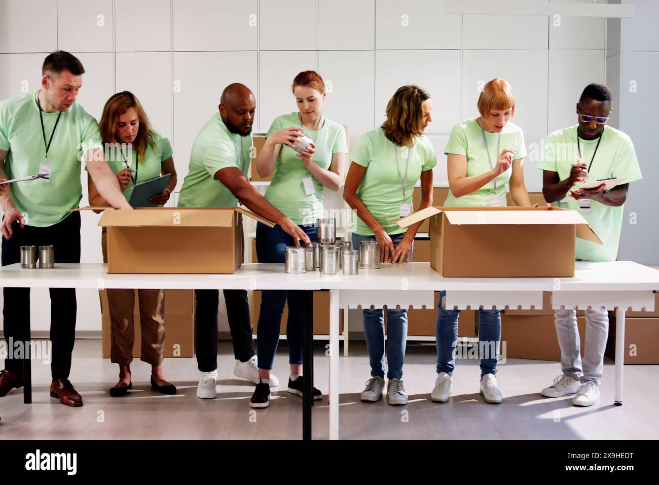 Man giving donation boxes hi-res stock photography and images - Alamy