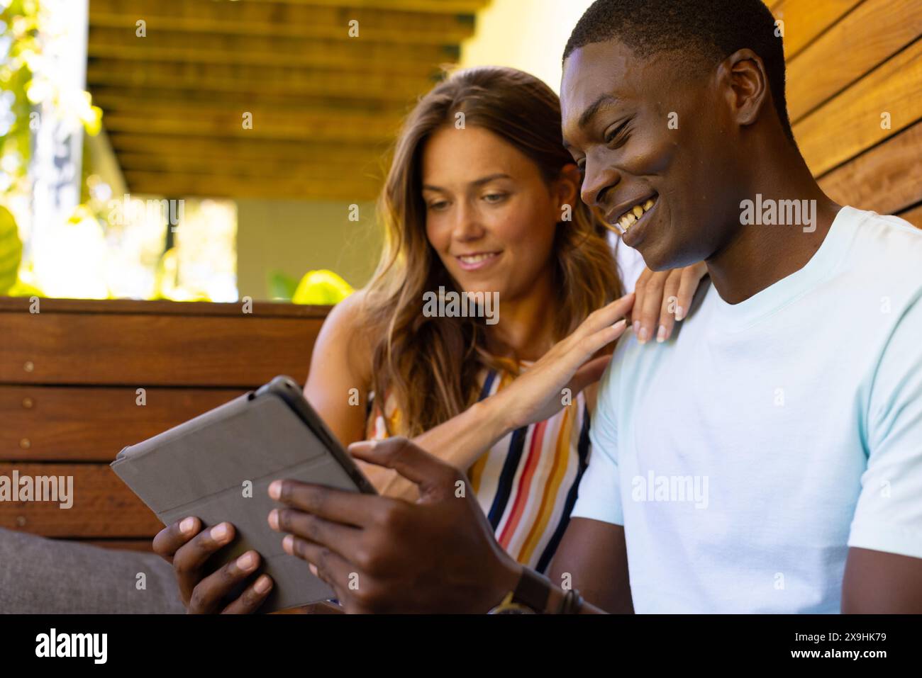 A diverse young couple studying tablet at home Stock Photo