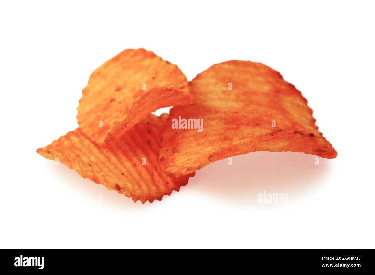 Grooved potato chips close up isolated on white background Stock Photo
