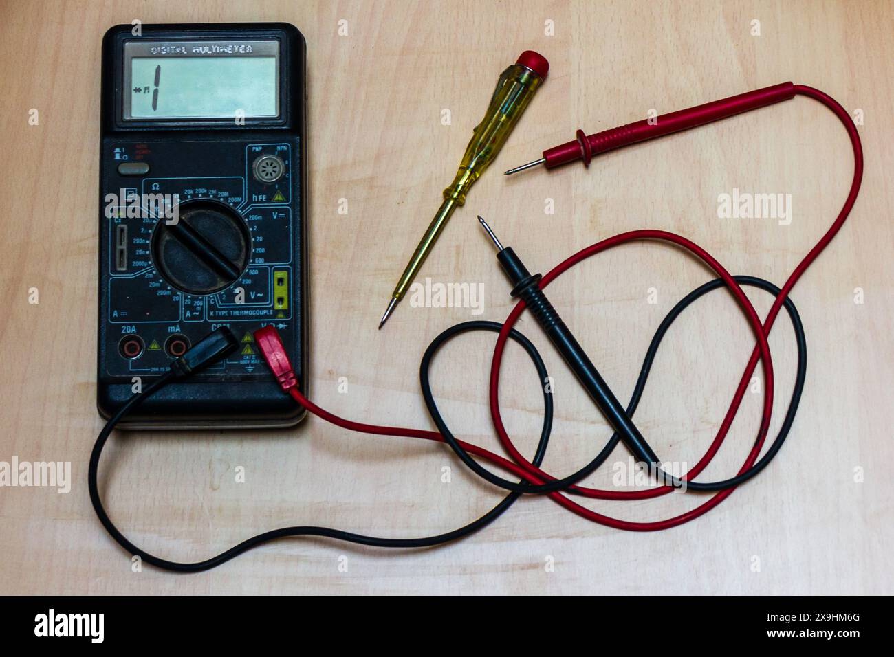 multi meter and electric tester on a wooden table Stock Photo