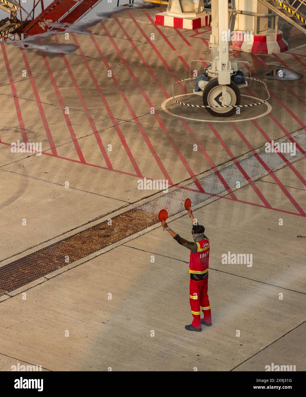 A picture of an aircraft marshaller working. Stock Photo