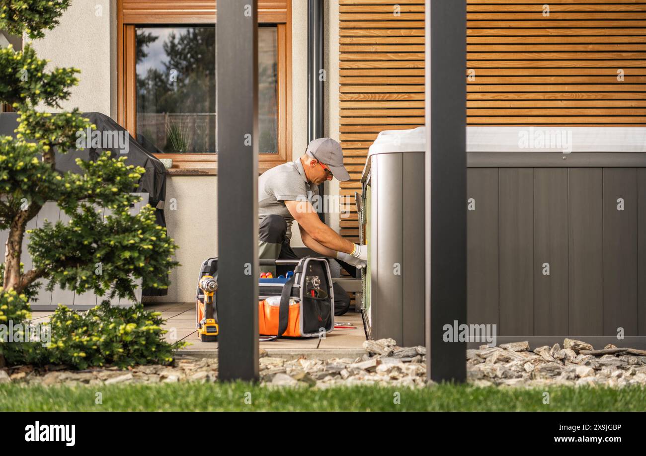 Hot Tub Maintenance Performed by Technician Stock Photo