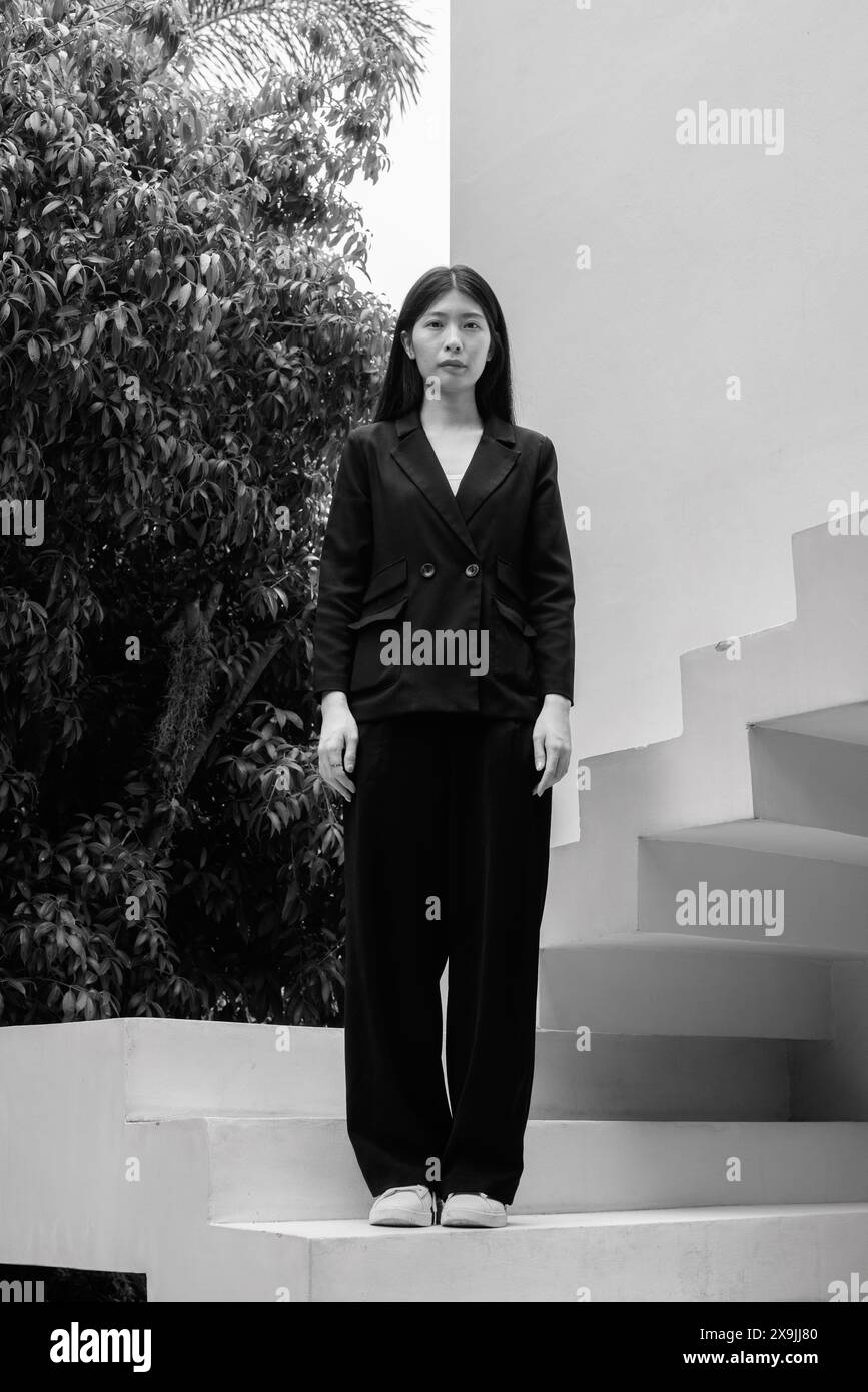 Professional woman in black suit hi-res stock photography and images ...