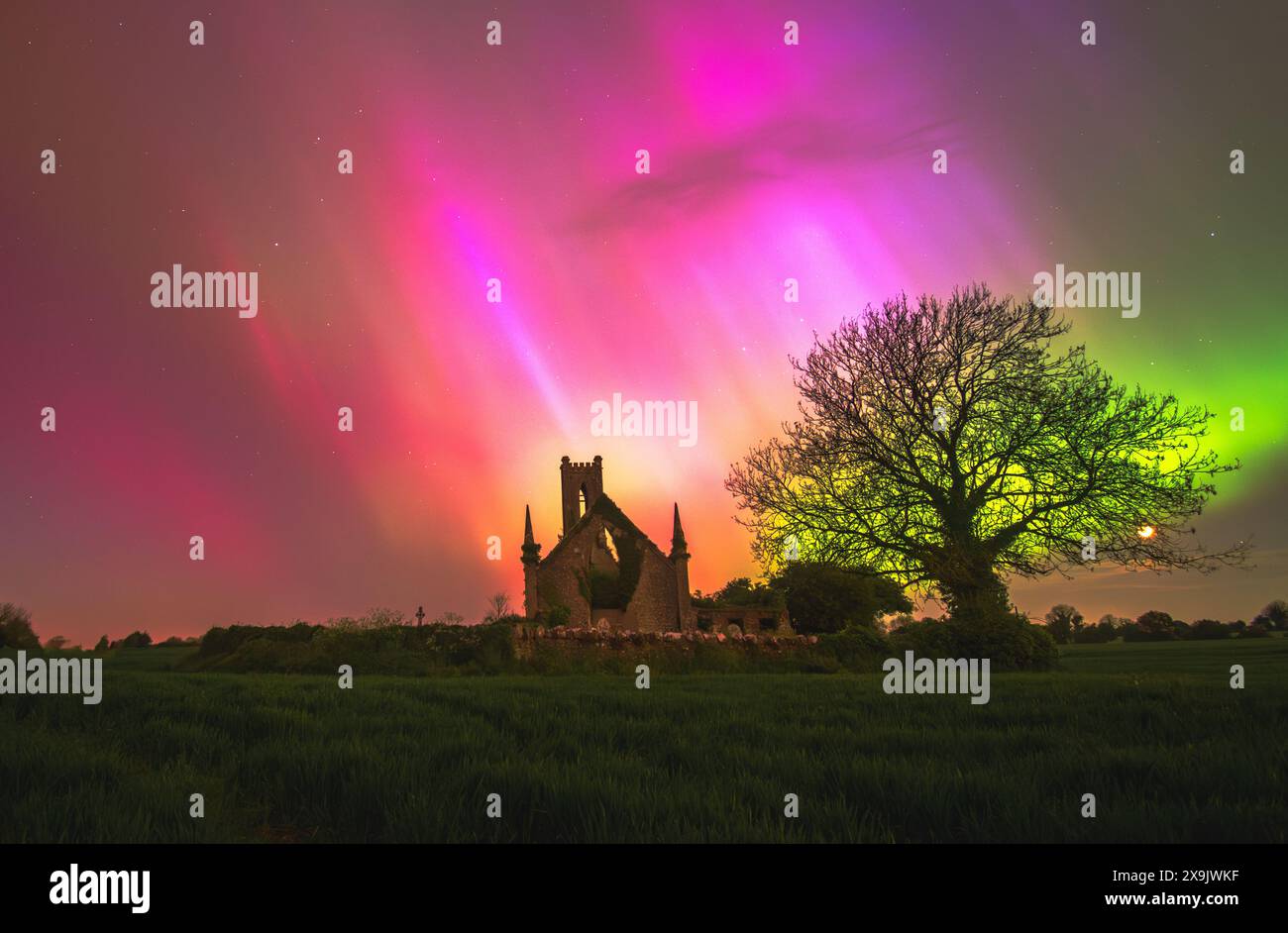Very bright aurora borealis display over Ballynafagh Church during the