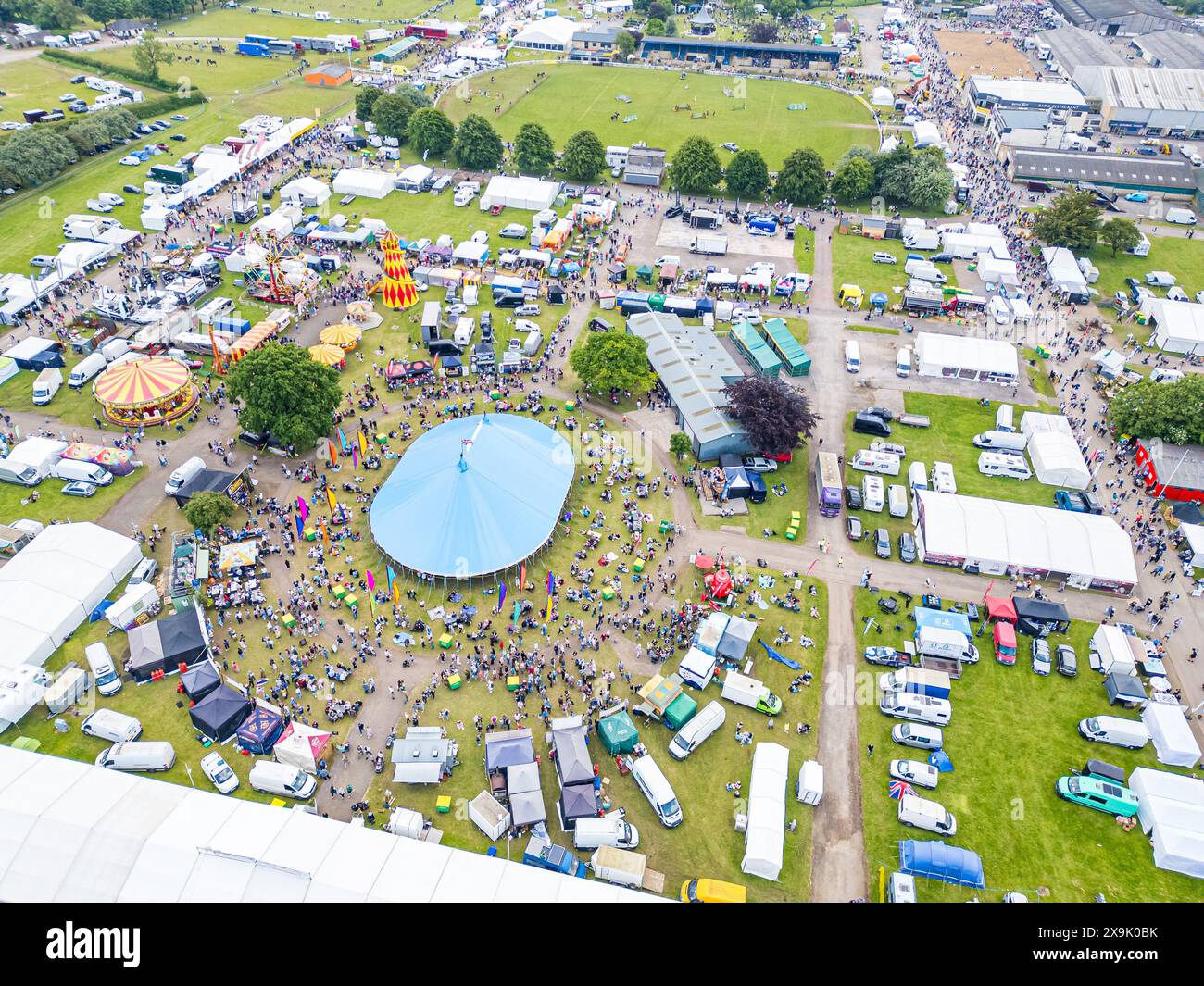 SHEPTON MALLET, SOMERSET, UK, 1st June, 2024, Aerial Drone high level shot from above showing the crowds and action at the Royal Bath and West Show 2024. Credit John Rose/Alamy Live News Stock Photo