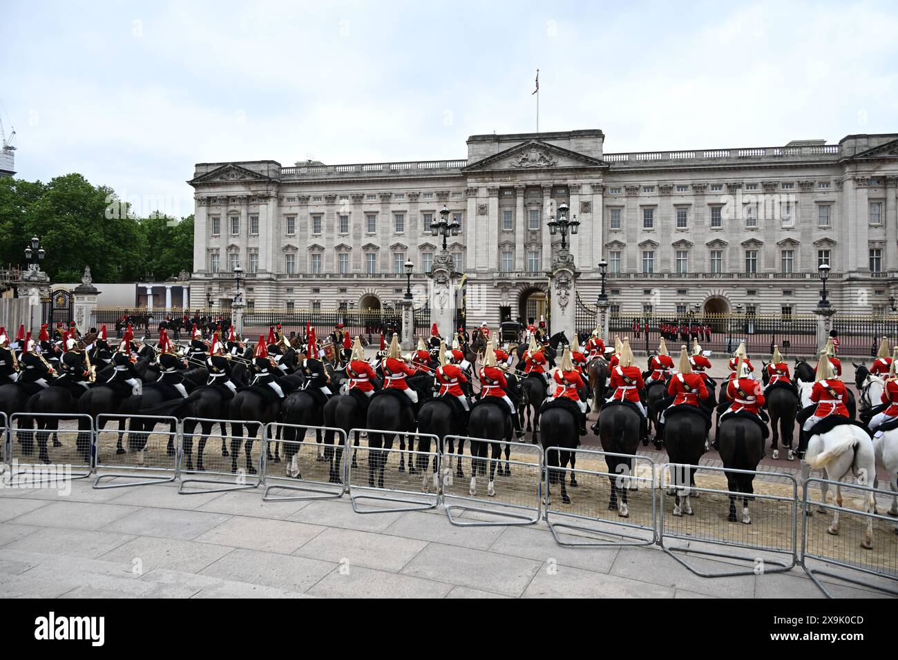 London, UK. 1st June, 2024. The Major General’s Review of the Trooping of the Colour for the King’s Birthday Parade takes place. This rehearsal is the first of two formal reviews in full dress uniform of the troops and horses before parading for HM The King’s Official Birthday Parade on the 15th June. The soldiers are inspected by Major General James Bowder OBE, The Major General Commanding the Household Division. Image: Mounted Household Cavalry line up outside Buckingham Palace as the King’s carriage arrives back from the Trooping of the Colour ceremony at Horse Guards Parade. Credit: Malcol Stock Photo