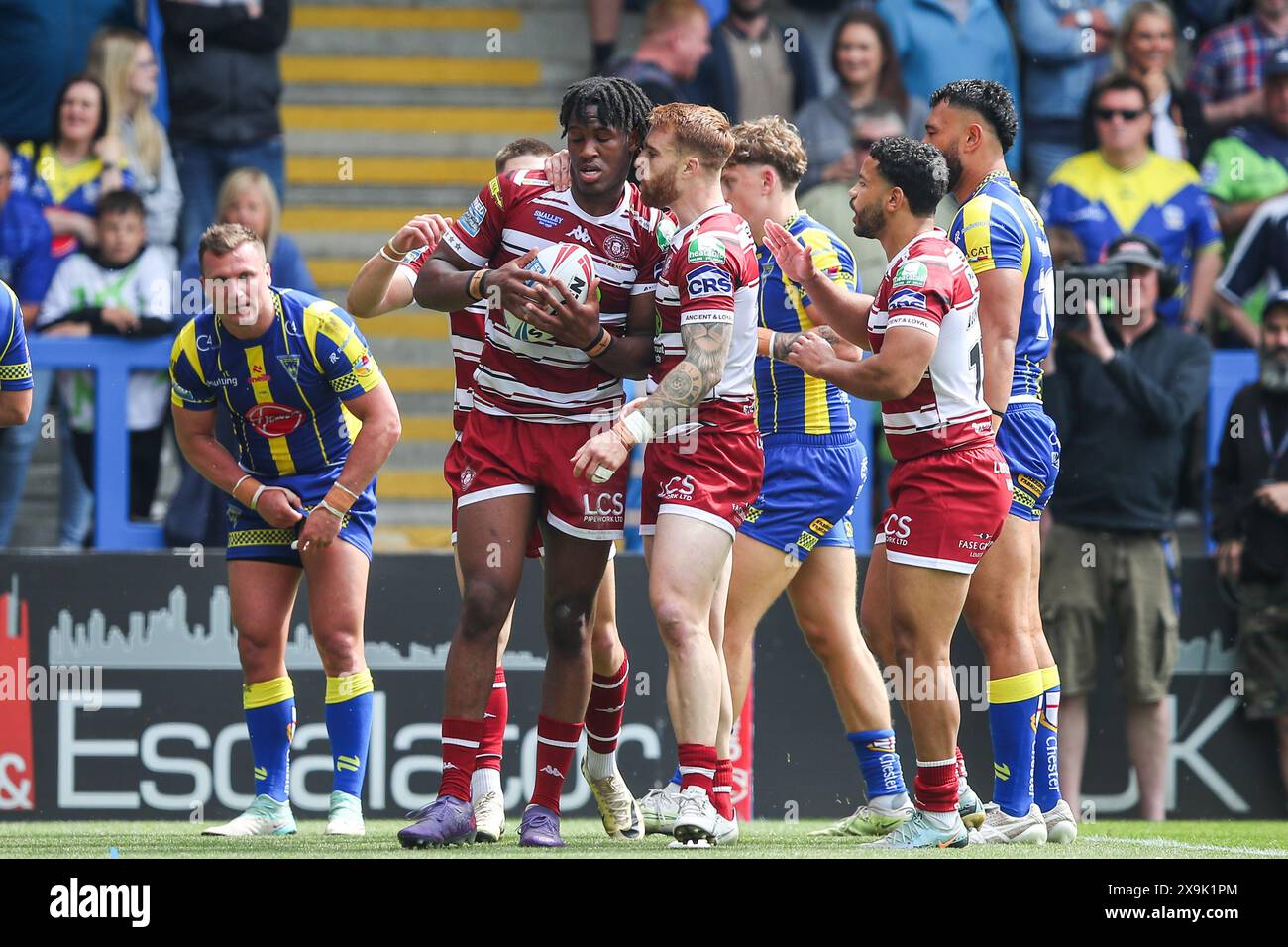 Junior Nsemba of Wigan Warriors celebrates his try to make it 12-4 during the Betfred Super League Round 13 match Warrington Wolves vs Wigan Warriors at Halliwell Jones Stadium, Warrington, United Kingdom, 1st June 2024  (Photo by Gareth Evans/News Images) in Warrington, United Kingdom on 6/1/2024. (Photo by Gareth Evans/News Images/Sipa USA) Stock Photo